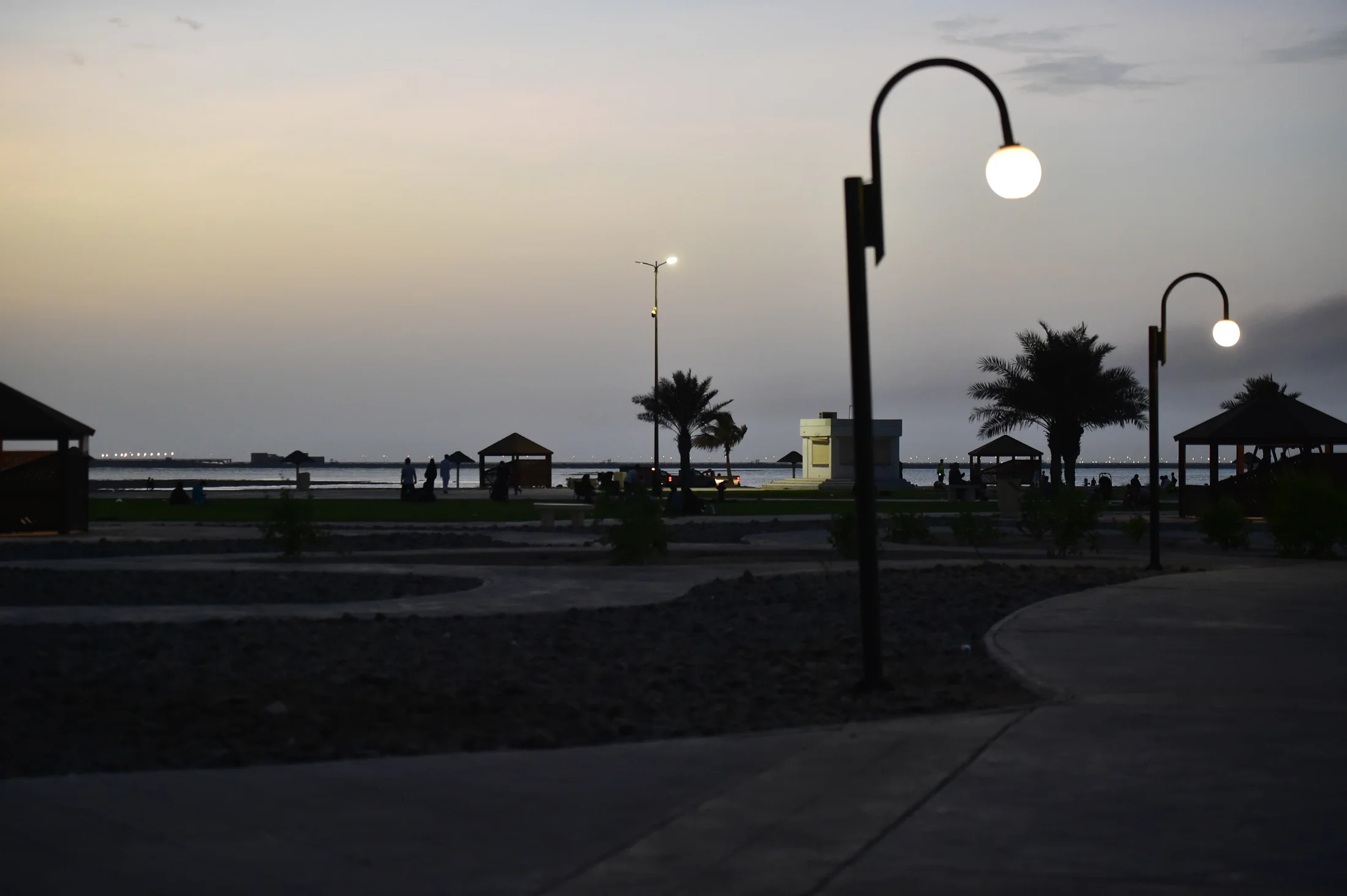 Public promenade and coastal landscape at Al Saif Beach